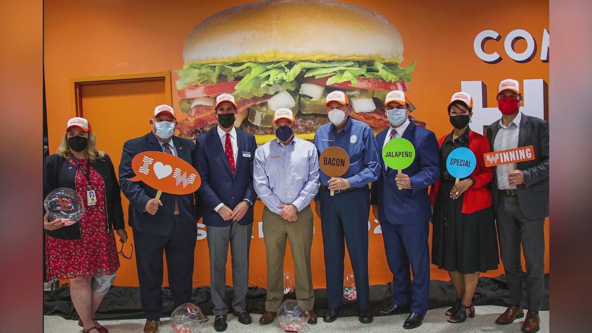 Travelers can stop by for some orange and white swag, and the chance to win Whataburger for a year.