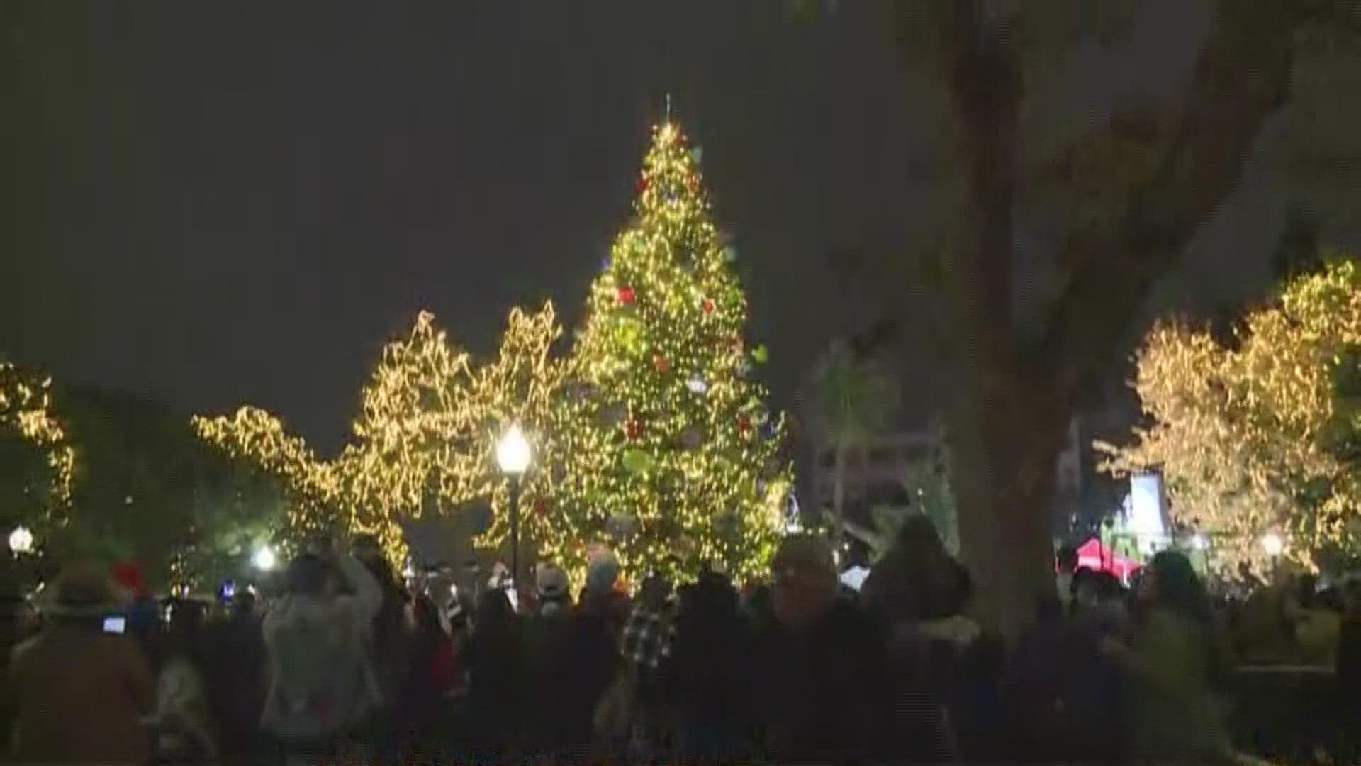 The nearly 50-foot Blue Spruce Christmas Tree is decorated with more than 10,000 white lights.