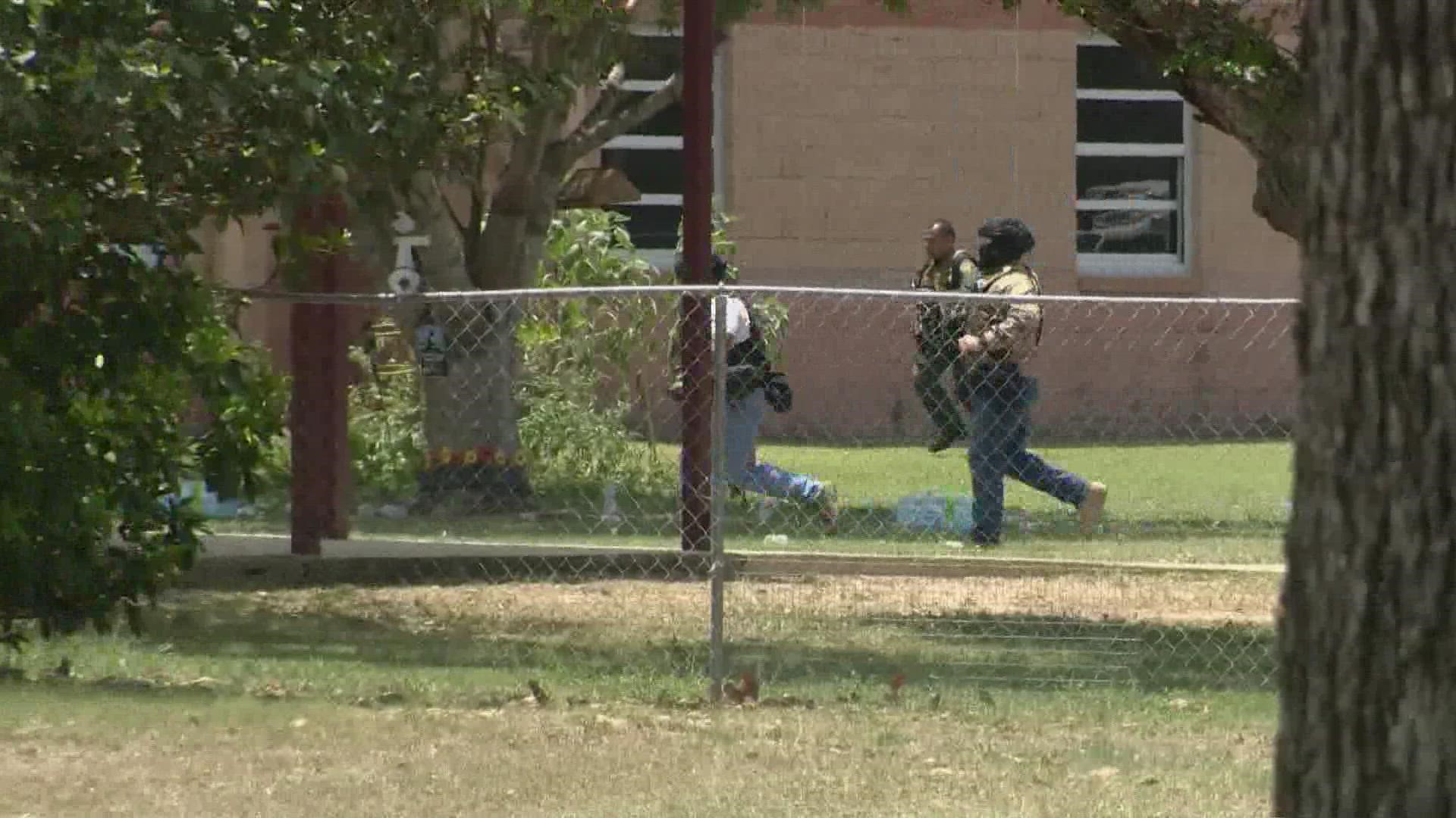 DPS is disputing reports that troopers were standing outside the classroom in Robb Elementary school while students inside were desperately calling 911 for help.