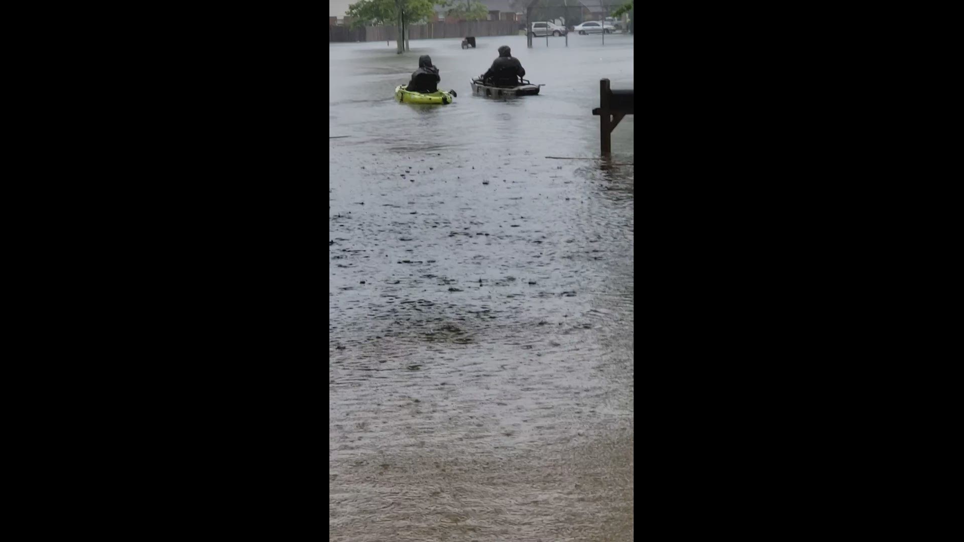 Kayakers took advantage of high water after a downpour flooded streets in Bacliff.
