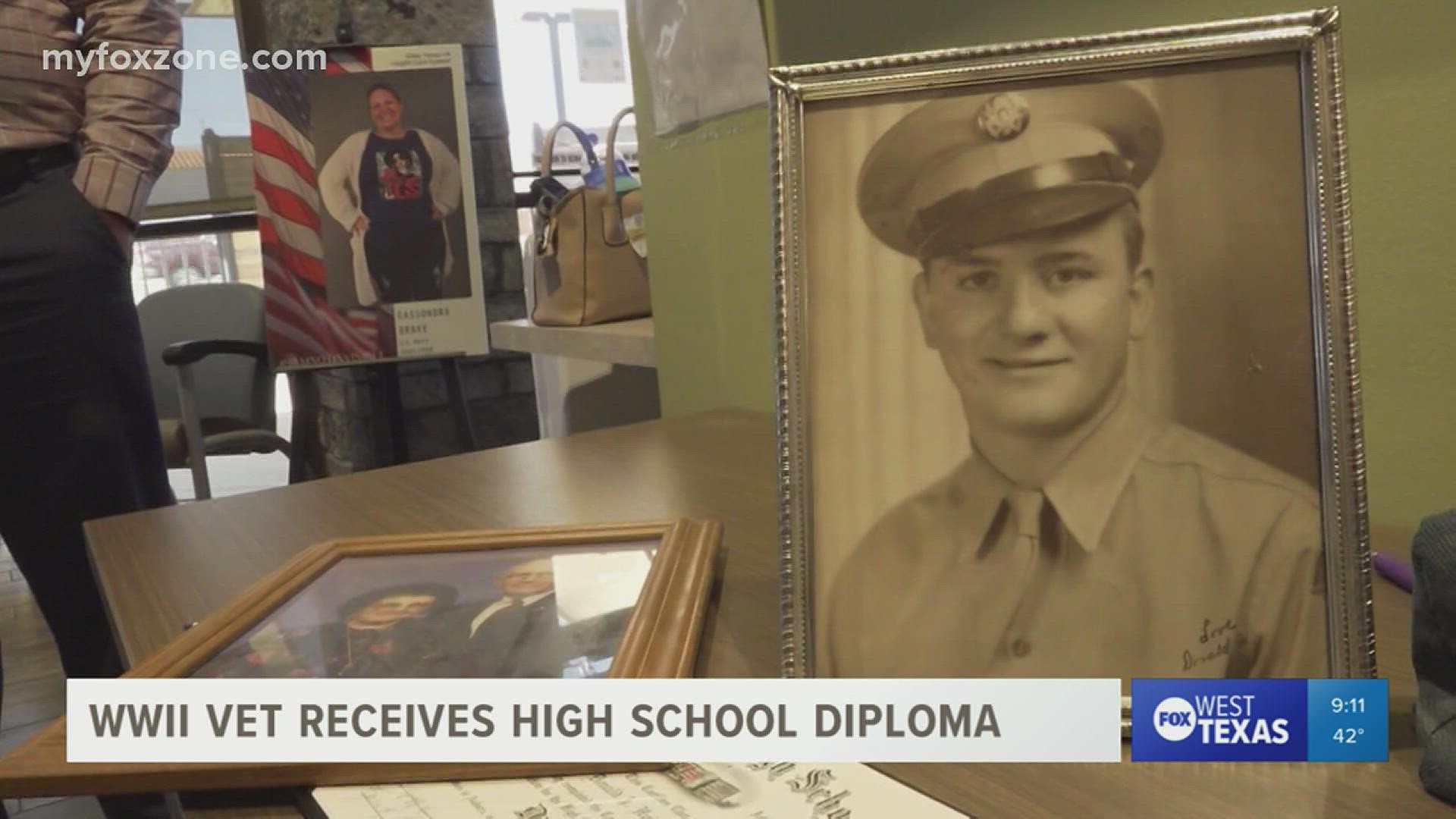 Donald Huisenga receives the high school diploma he missed when he was drafted in 1943.