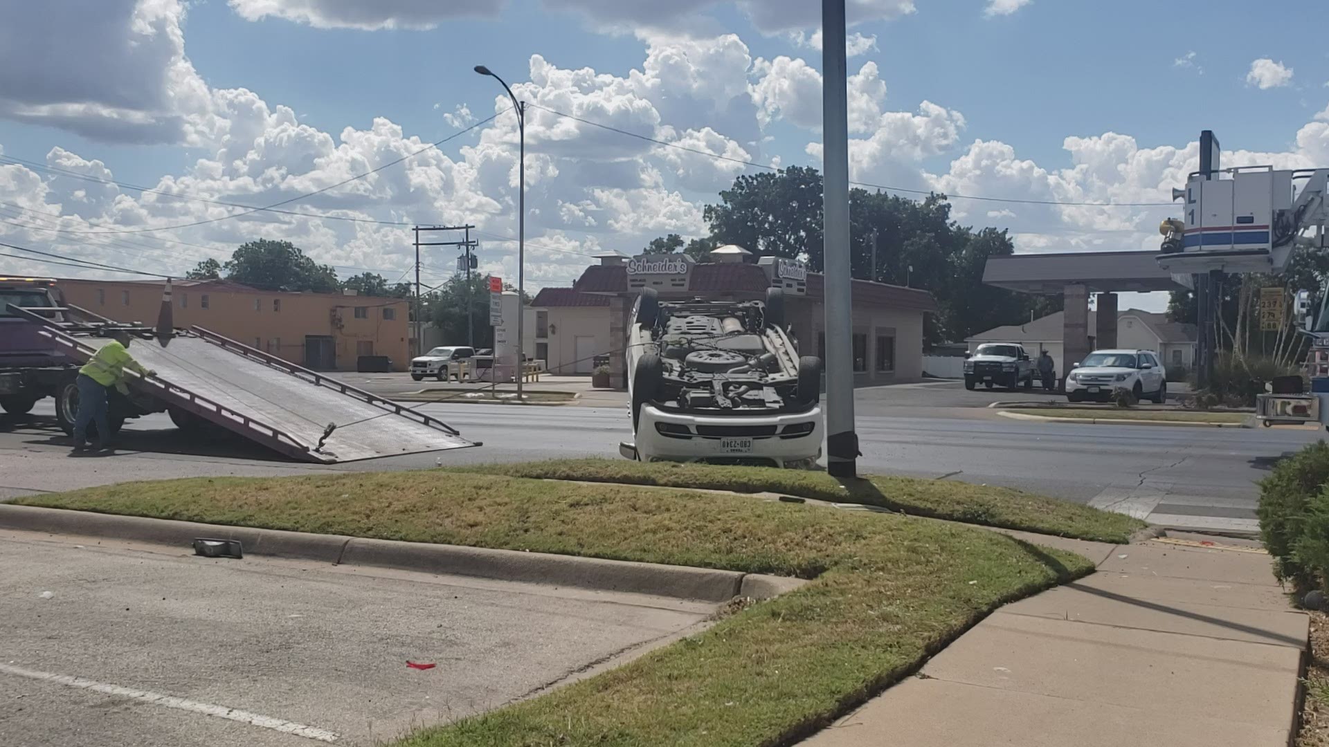 Two vans collided at the intersection of West Harris Avenue and South Abe Street, causing one van to roll over.