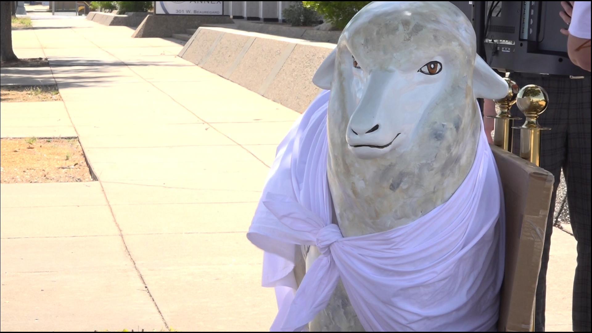 PETA held a ribbon-cutting for its sheep statue in protest of the wool and mohair industry. Protesters of the animal rights group attended the event as well.