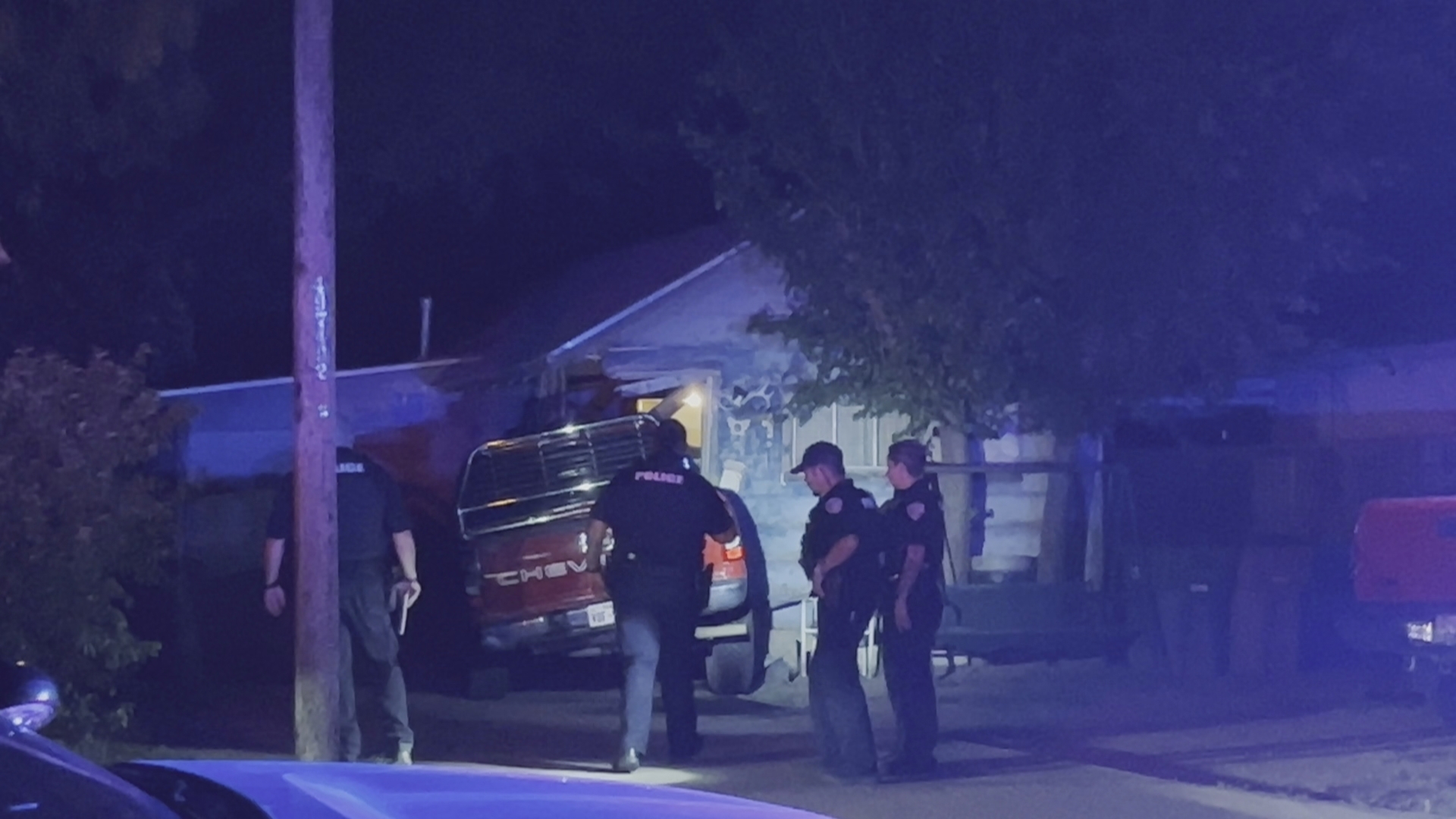 Police respond to a truck crashed into a home on Avenue J near Hill st.