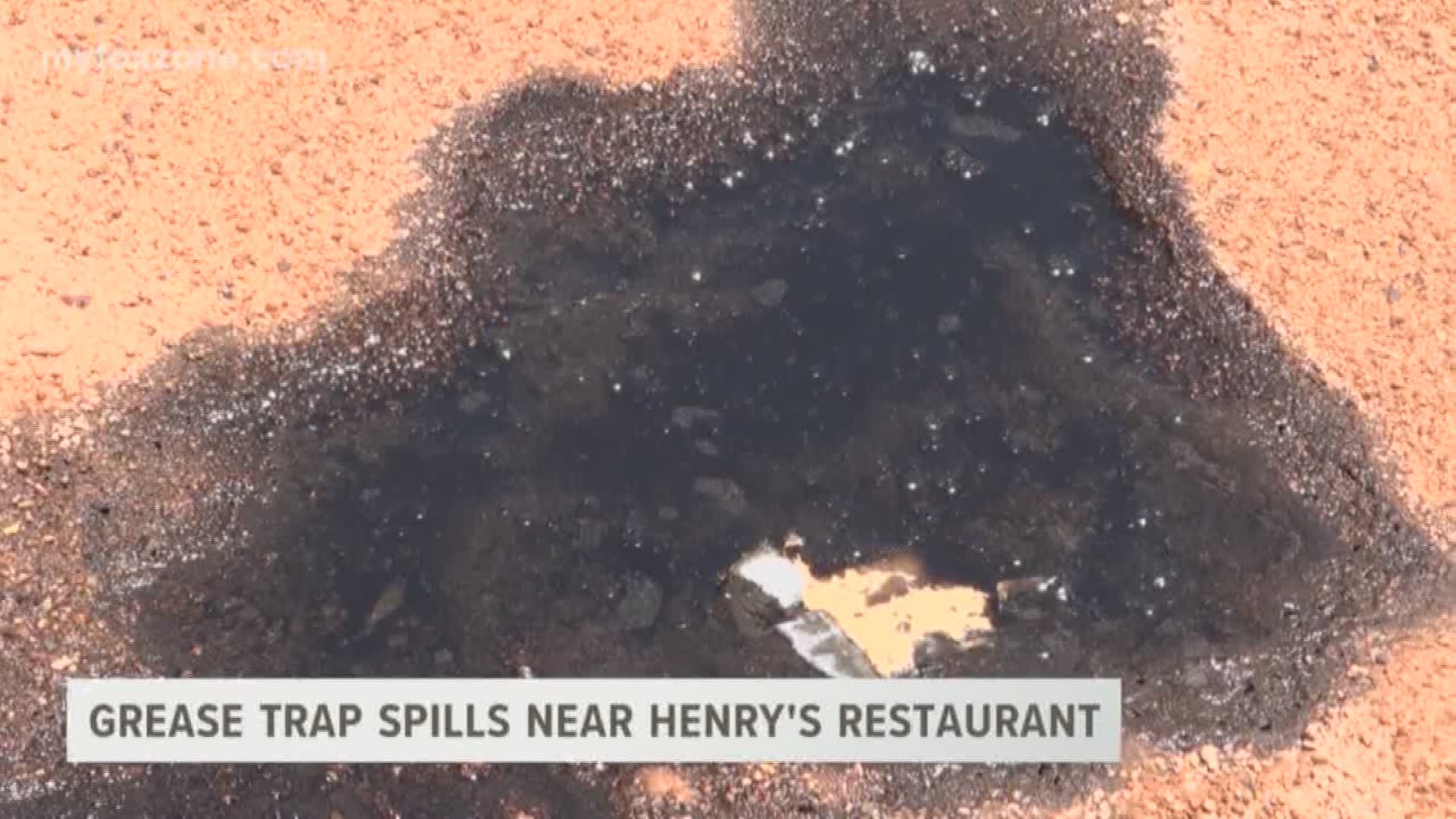 Grease trap spills near Henry's restaurant.