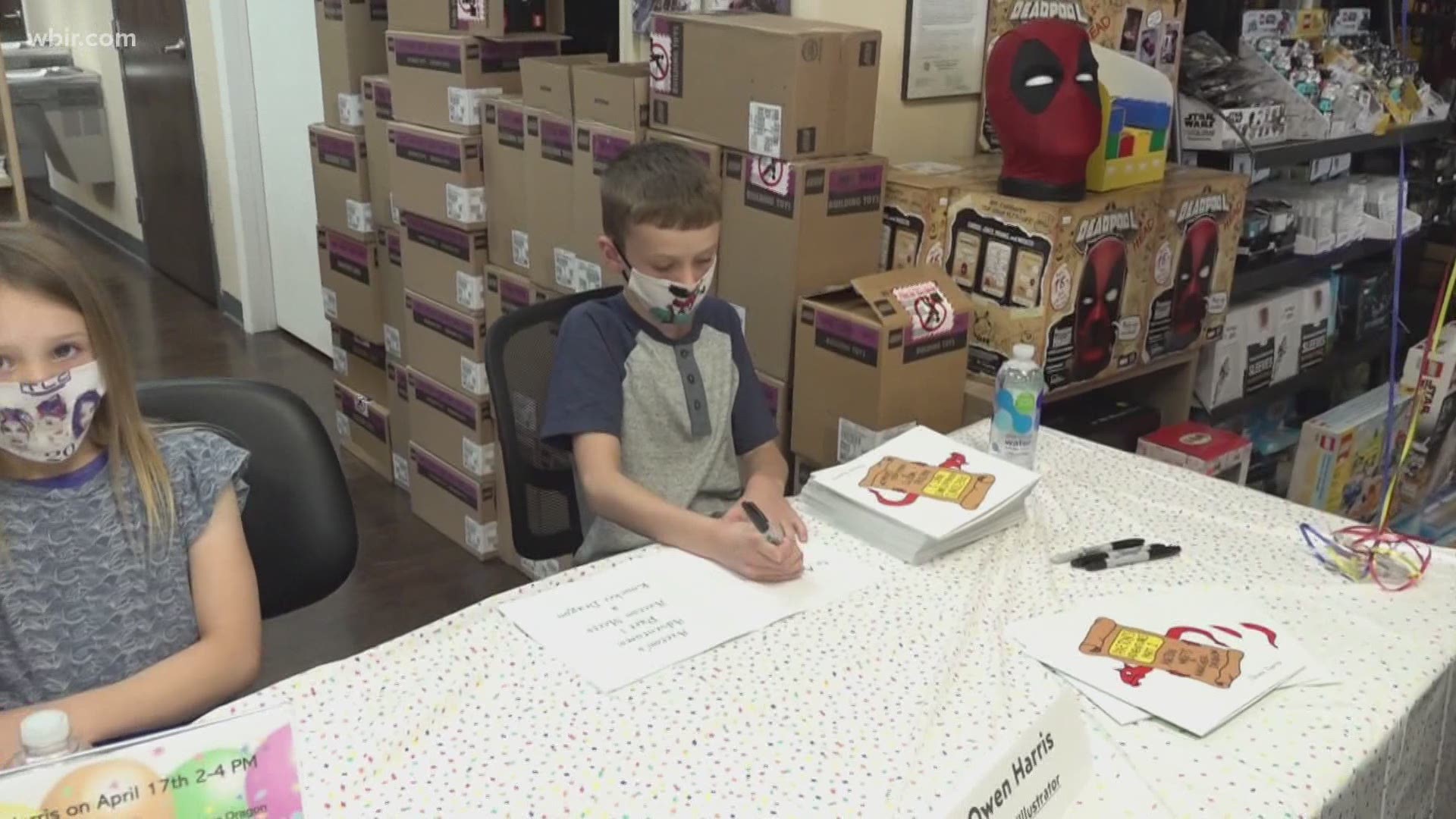 Owen Harris, 10, was at BrickHouse Collectibles to meet some of his fans and sign copies of his book, "Axeton's Adventures Part I: Axeton Meets a Knucker Dragon."