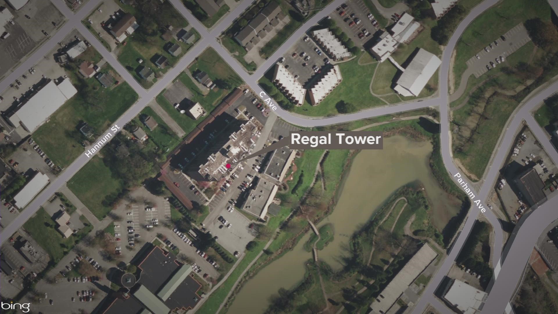 Crews initially responded to a fire at Regal Tower and later found two people dead, saying both had been shot.