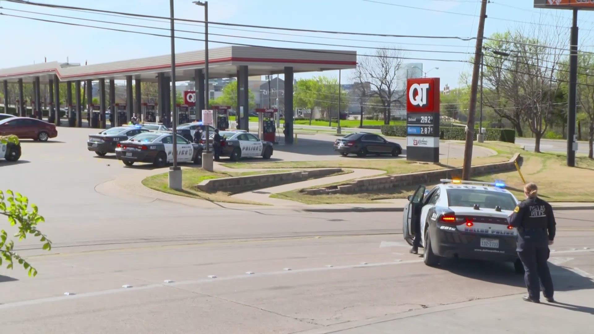 Dallas police say a woman was taken into custody after SWAT fired a flash bang and gas canisters into the back of her vehicle