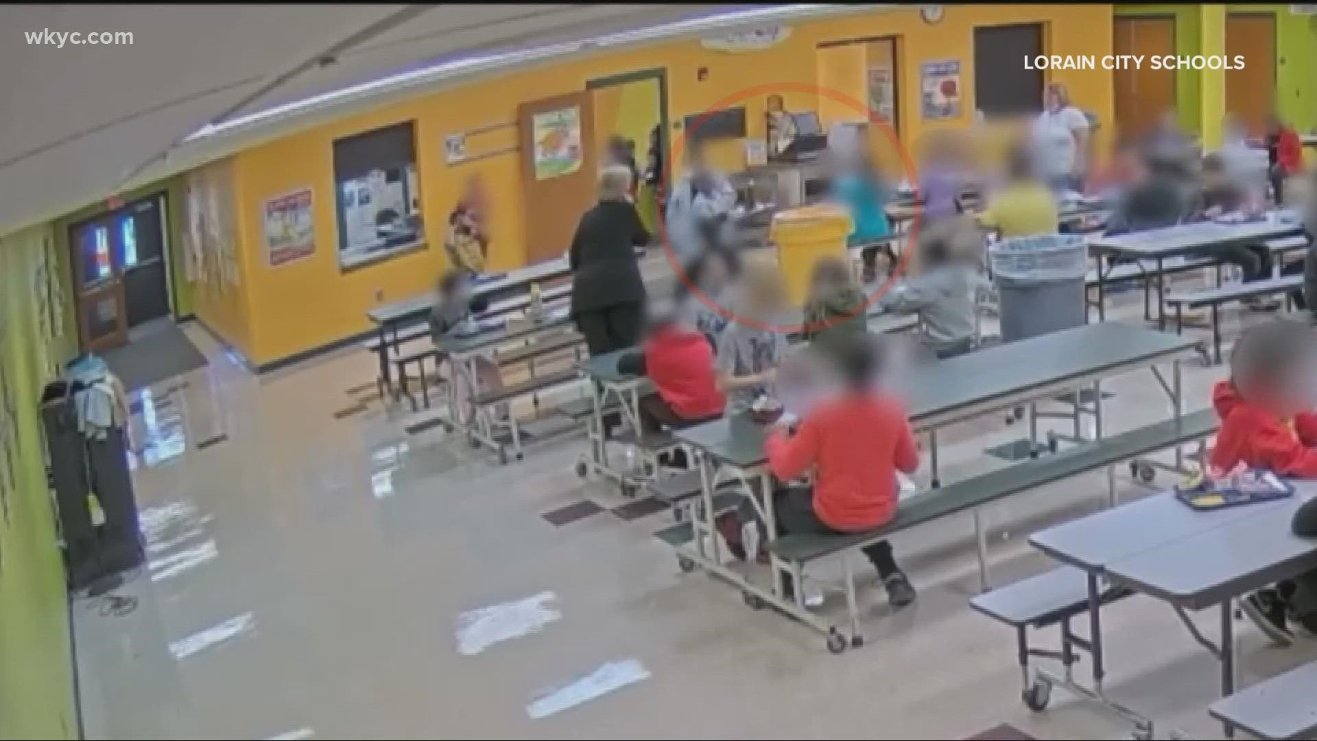 The school district released new video today from the cafeteria of Palm Elementary, showing a 9-year-old student throwing away a package of food into a trash can.